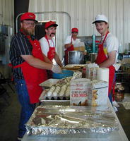 The Big Piney/ Marbleton Volunteer Firemen breading catfish.