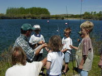 Listening to instructions during Kid's Fishing Day