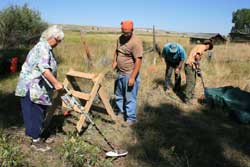 Judi Myers (L) and  Rollie (blue hat) help with the archaeological survey at the Lander Trail New Fork historical site in August.